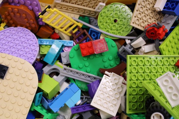 close up of legos in a bucket